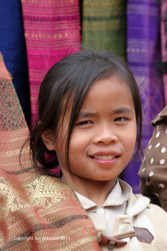 Selling Silk, Mekong River Village, Laos Selling Silk, Mekong River Village, Laos.
